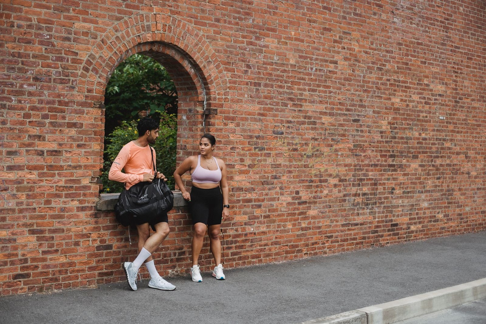 Two training partners talking on the street after a session