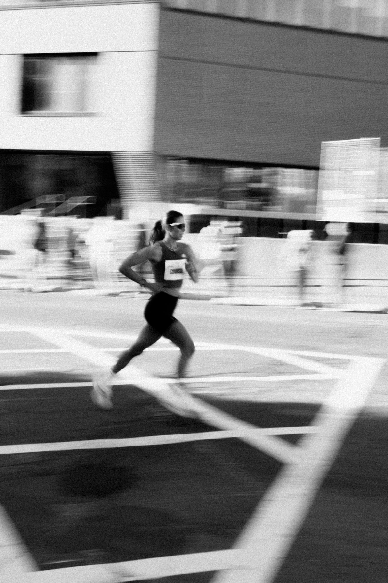 A marathon runner in motion, black and white