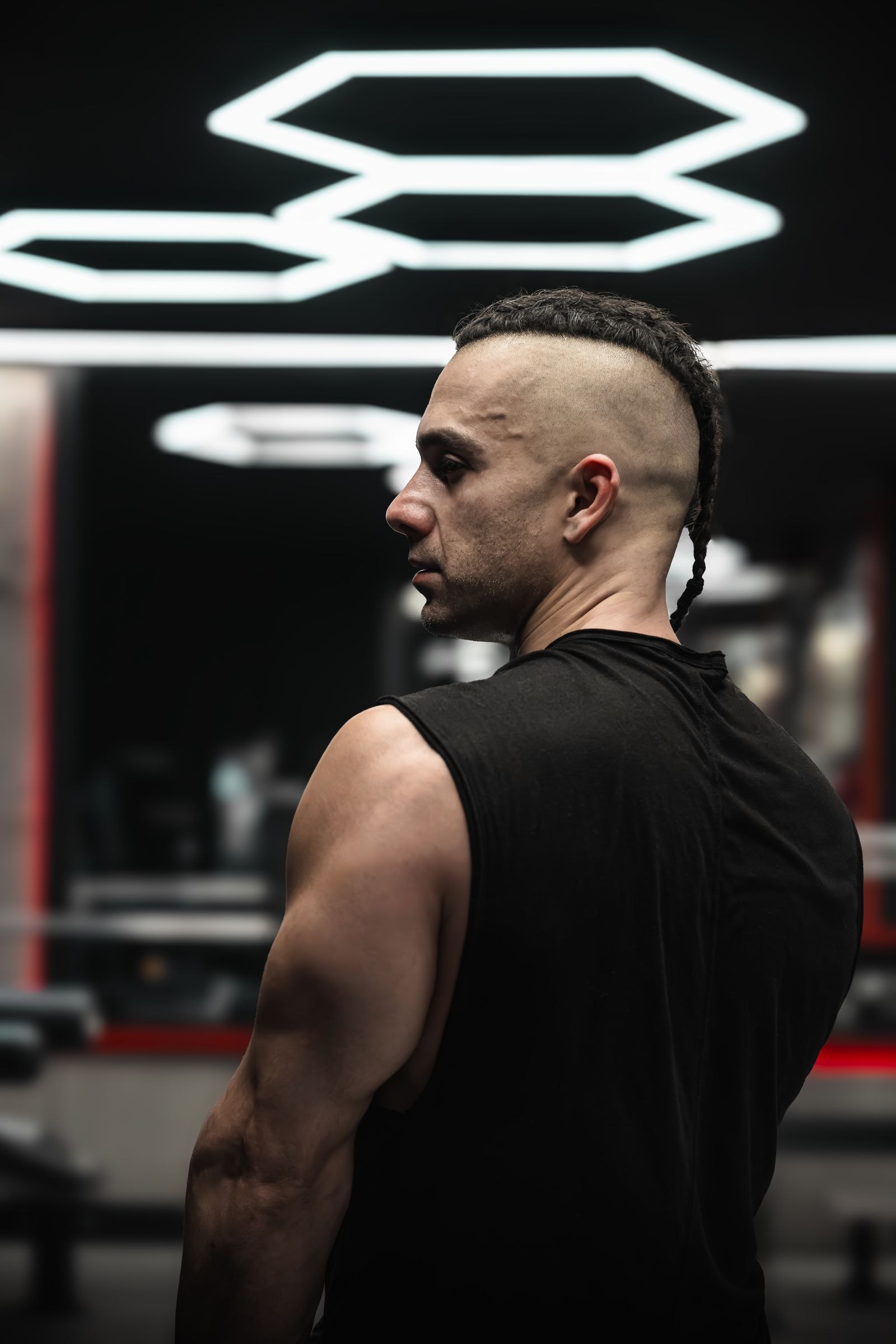 A member under the gym's hexagon lights