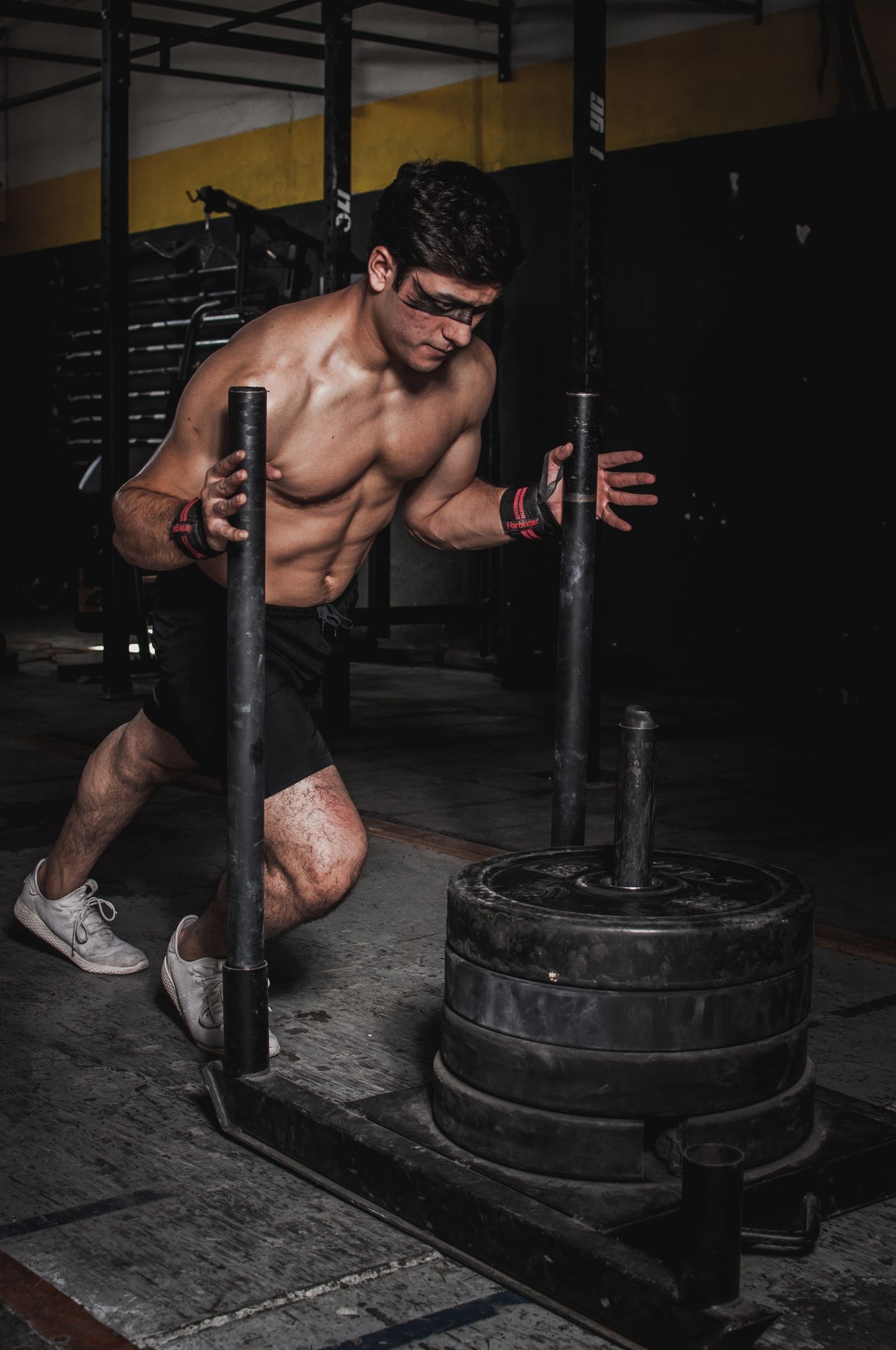 An athlete leaning into a loaded sled